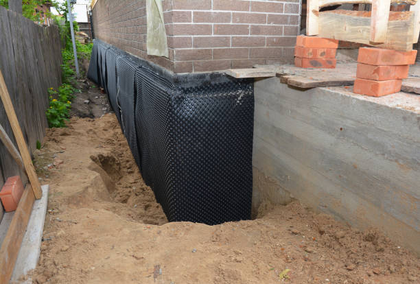Happy homeowners after waterproofing job in Partridge